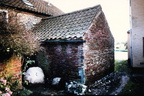 Cobbler's shop, 1987. Note the wall made from tiles